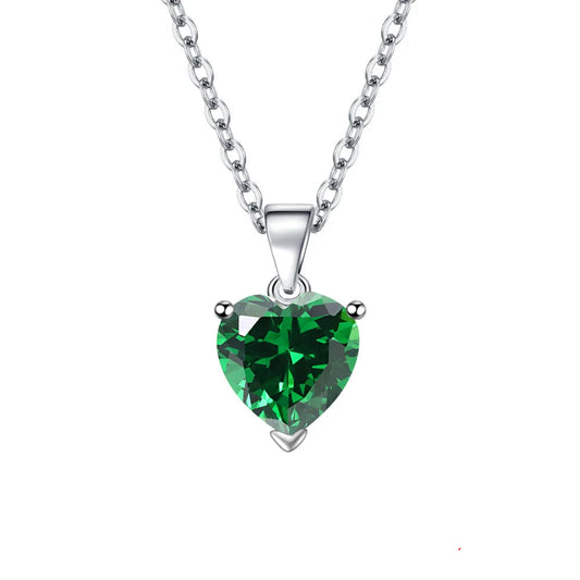 A heart-shaped green gemstone pendant necklace on a silver chain, shown against a white background