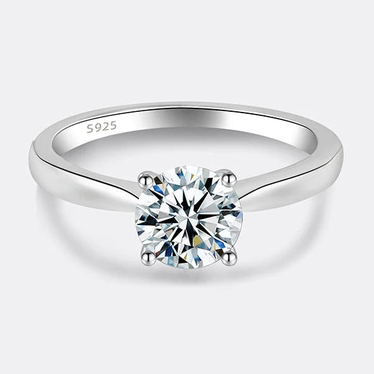 Silver ring with moissanite gemstone on a white background