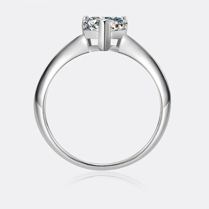 Silver ring with a diamond on a white background