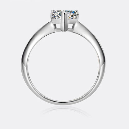 Silver ring with a diamond on a white background