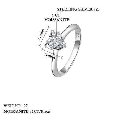Silver ring with moissanite gemstone on a white background, featuring product details.