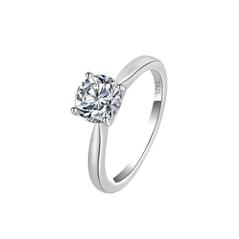 A silver solitaire engagement ring with a round-cut clear gemstone