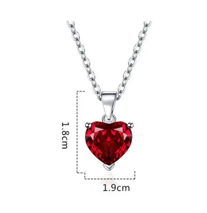Silver heart-shaped red gemstone pendant necklace with a silver chai