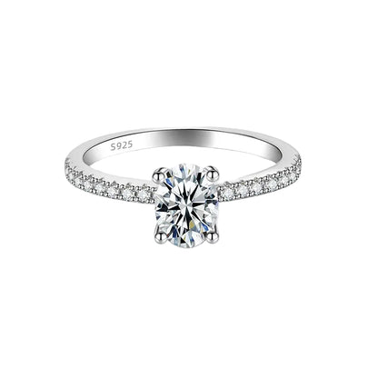 Silver ring with a diamond on a white background,