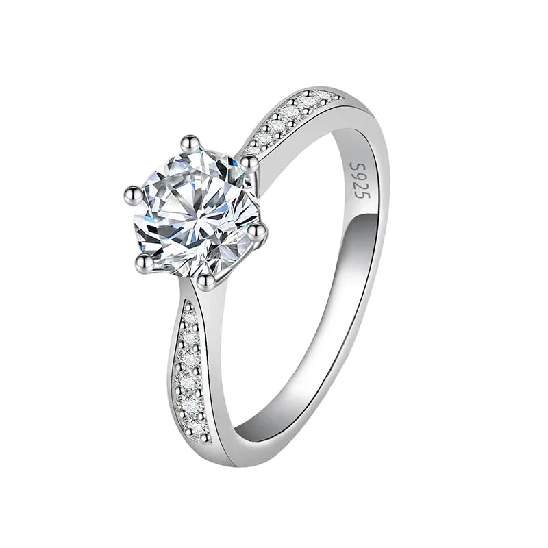 Silver ring with a large central gemstone and smaller stones