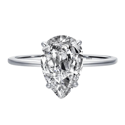 A pear-cut cubic zirconia engagement ring in a silver-toned band