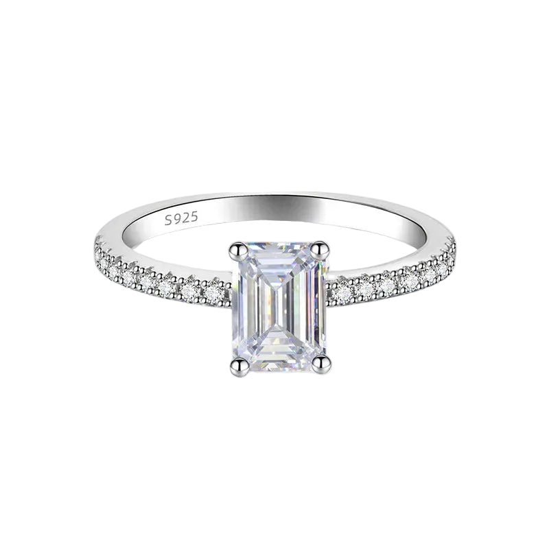 Silver ring with a large diamond and smaller diamonds on the band