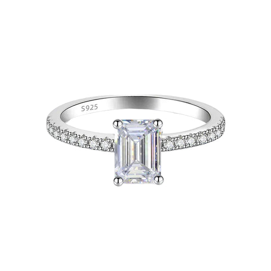Silver ring with a large diamond and smaller diamonds on the band